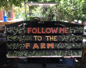Truck painted to read "Follow Me to the Farm" 